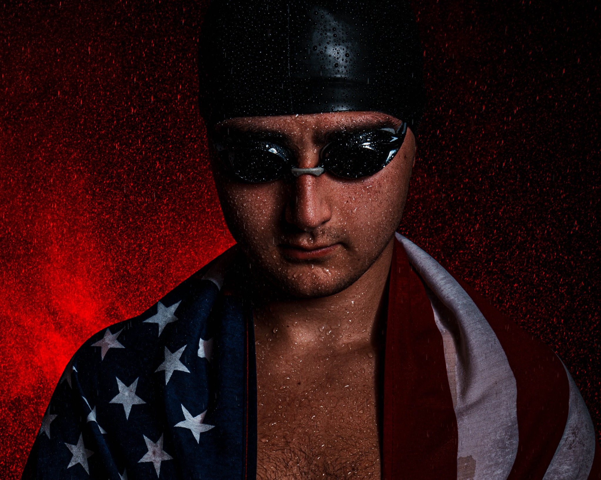 Dramatic swimmer portrait draped in an American flag